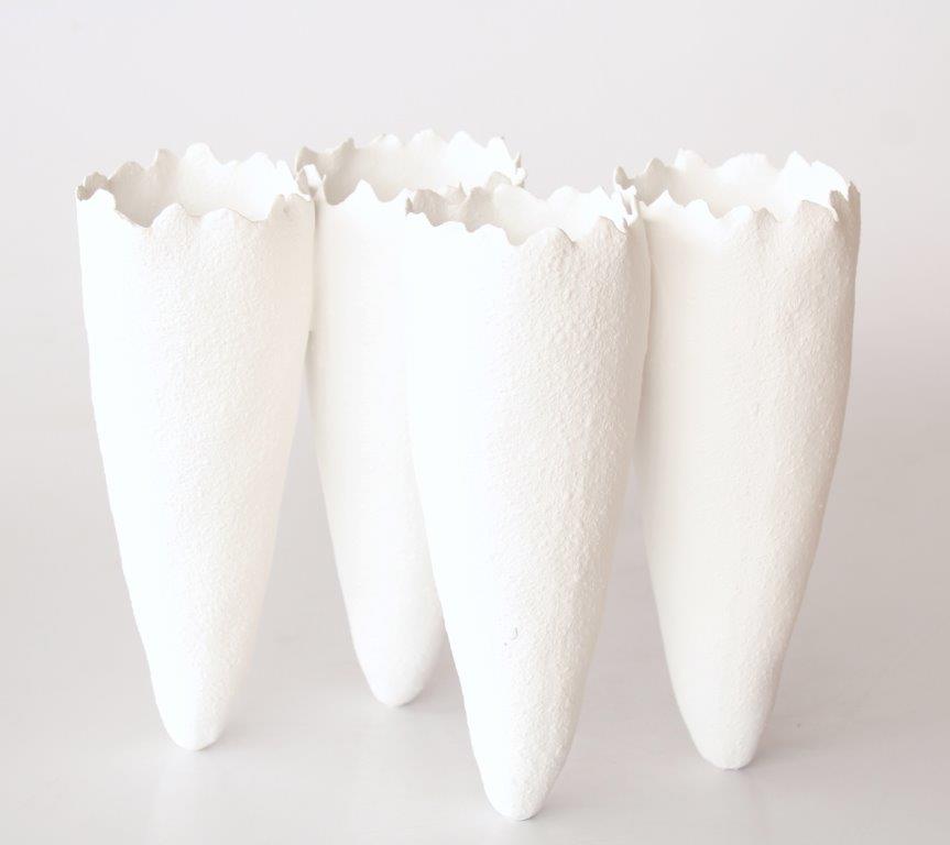 4 White Ceramic Vases Joined Upright