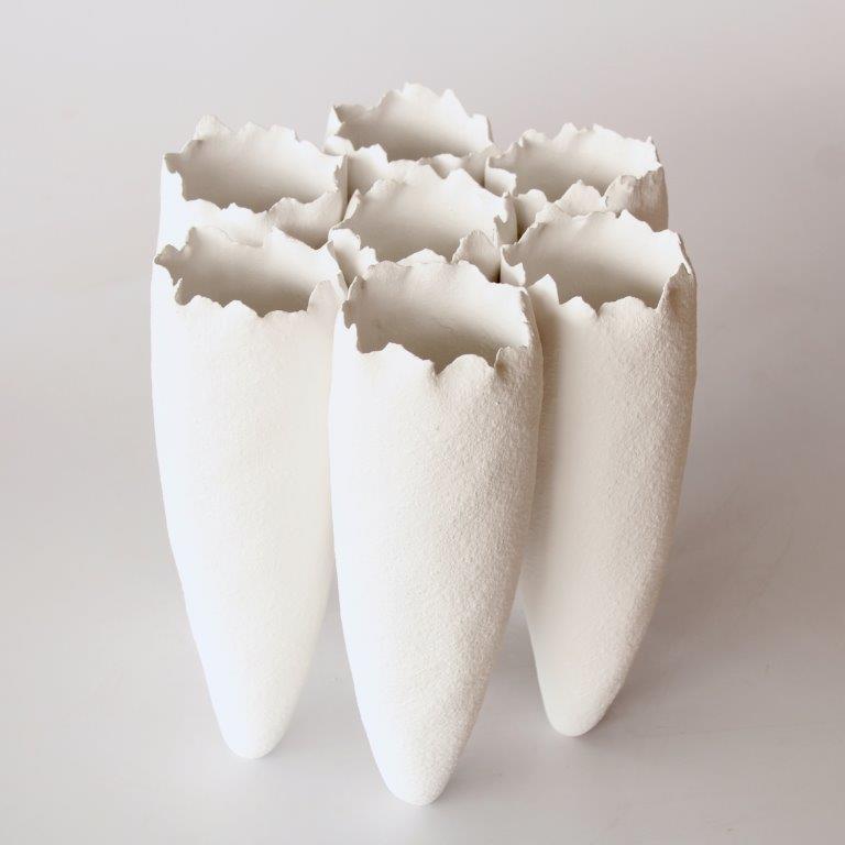 7 White Ceramic Vases Joined