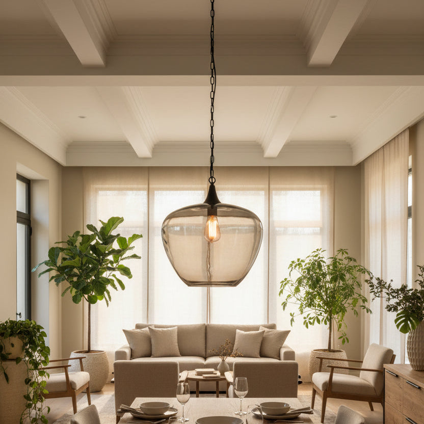 Smoked glass pendant light with a visible bulb on a black background