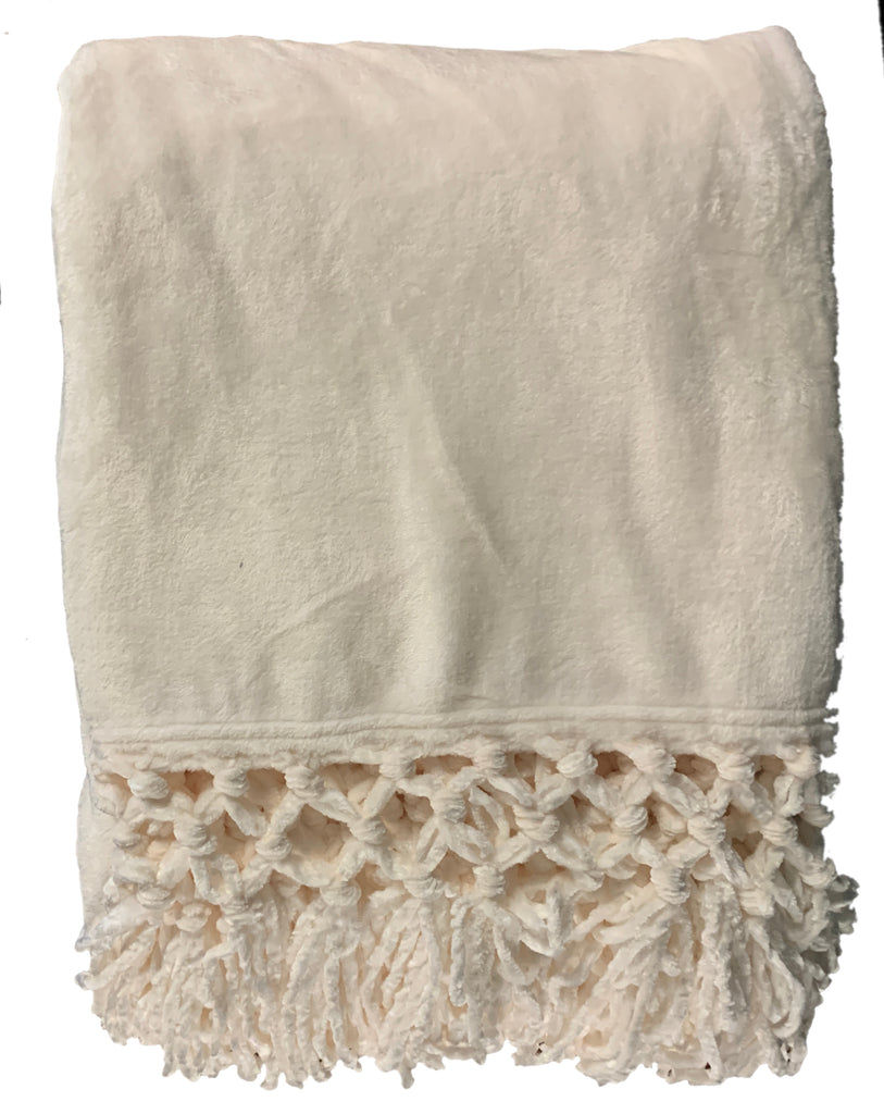 Indulge in luxury with our Plush Throw in Cream. Made with premium materials, this throw is not only soft and warm, but also adds an elegant touch to any room. Wrap yourself in comfort and style with this sophisticated piece. A must-have for those who appreciate the finer things in life.