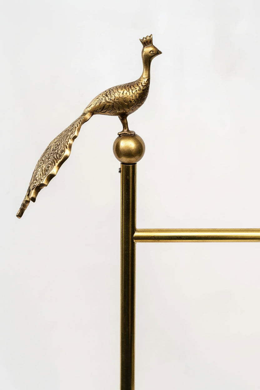Brass peacock decorative finial on a white background