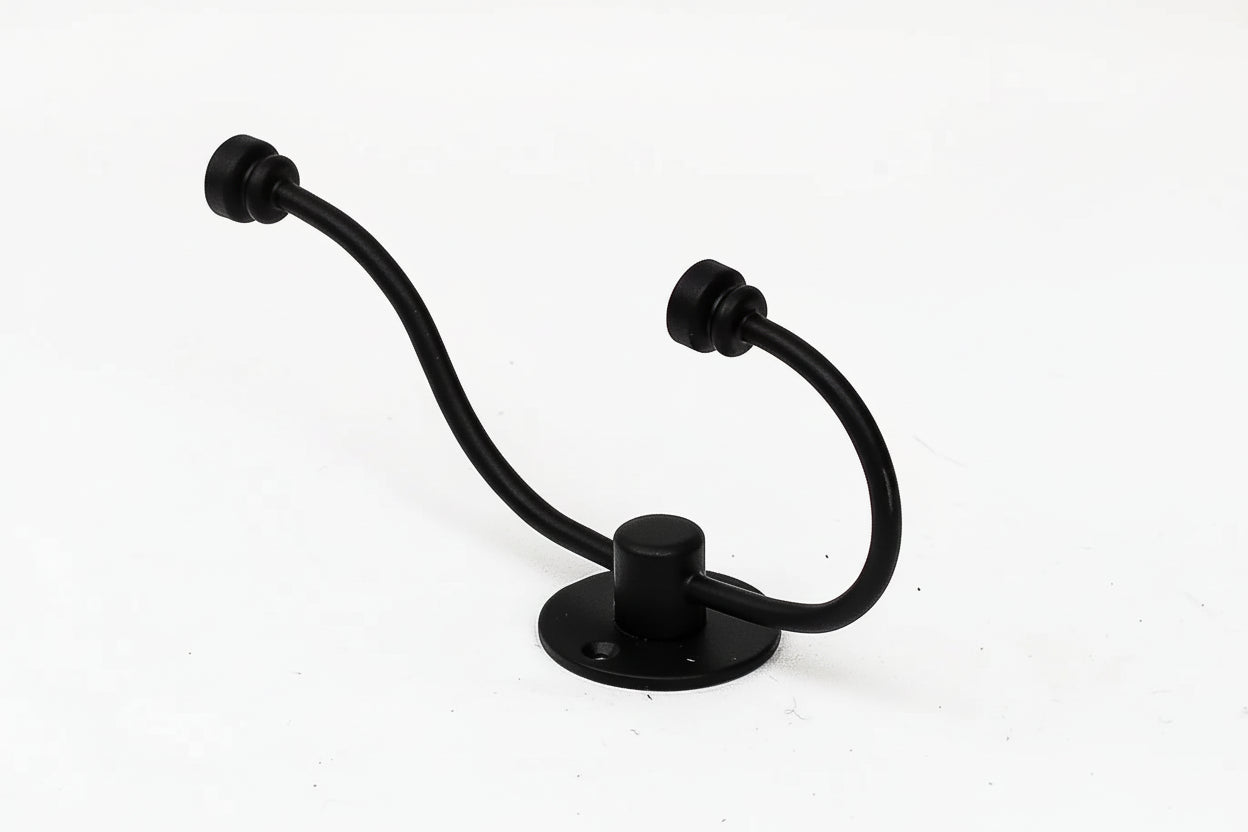 Black metal towel hook on a white background