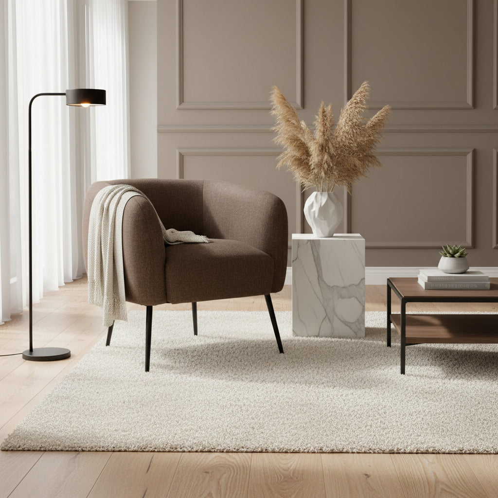 Brown armchair with black legs on a white background