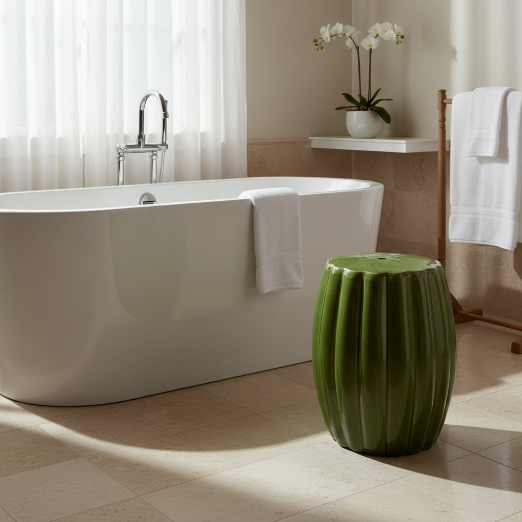 Green ceramic stool with ribbed texture on a beige background