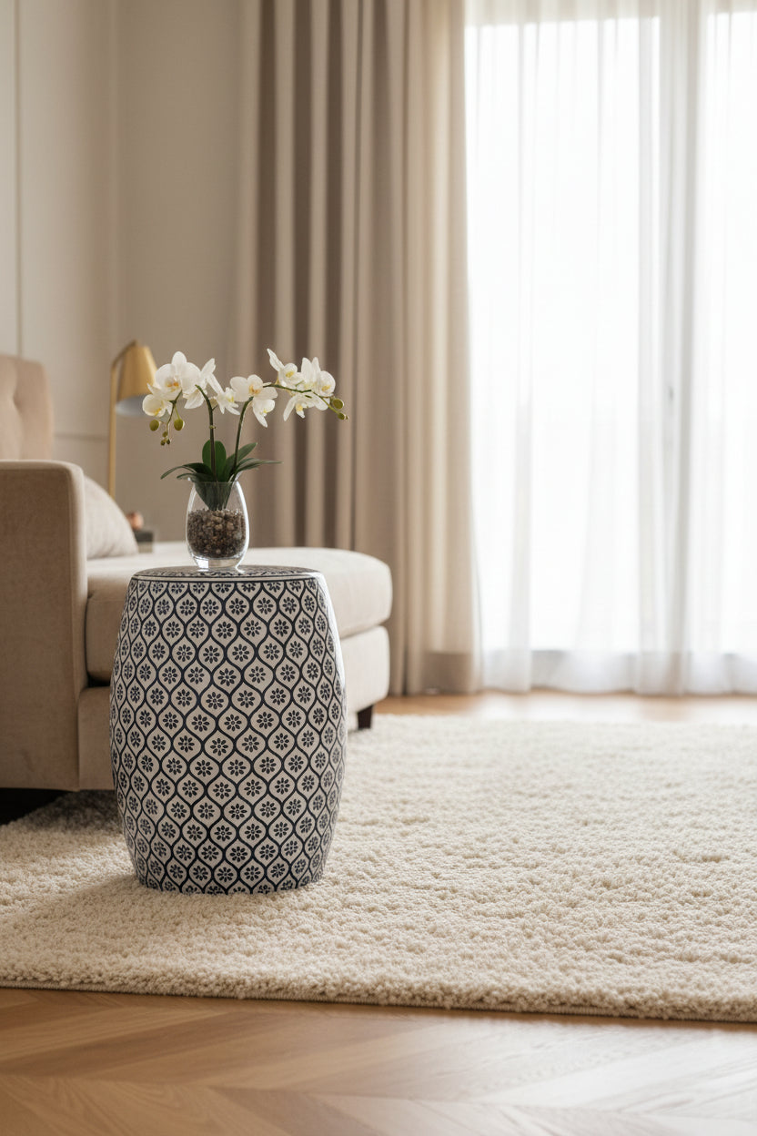 Blue and white patterned stool on a white background