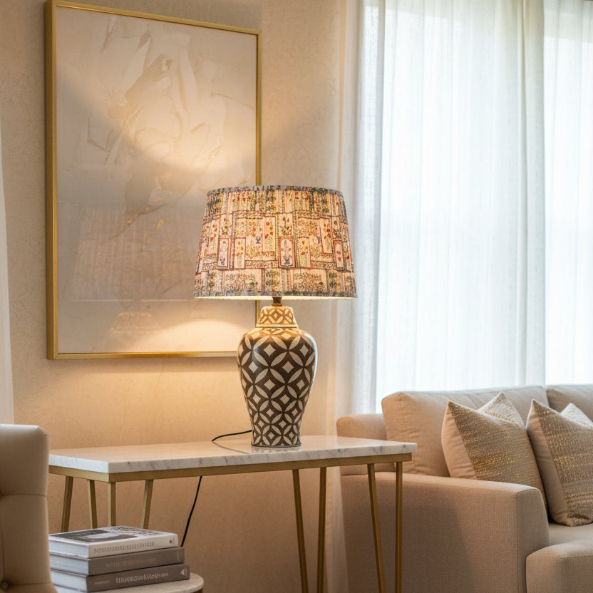 Decorative lamp with patterned shade and base on a light background