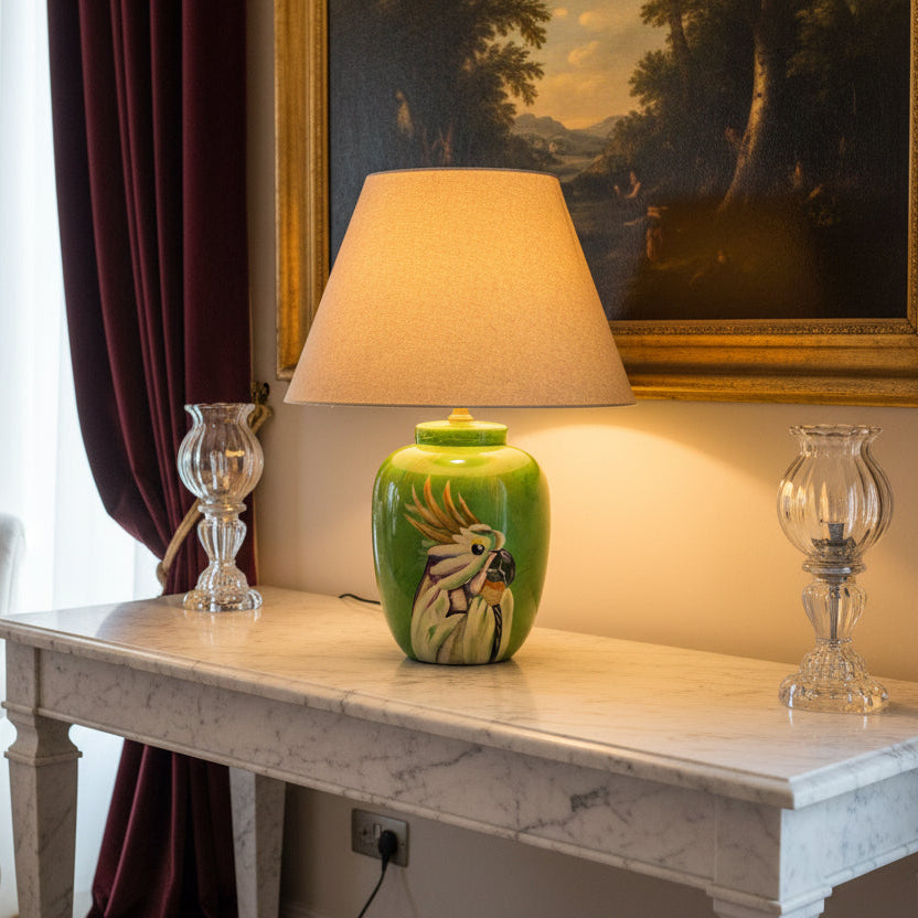 Green lamp with a parrot design on a white background