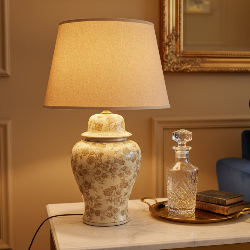 Decorative lamp with floral patterns on a plain background