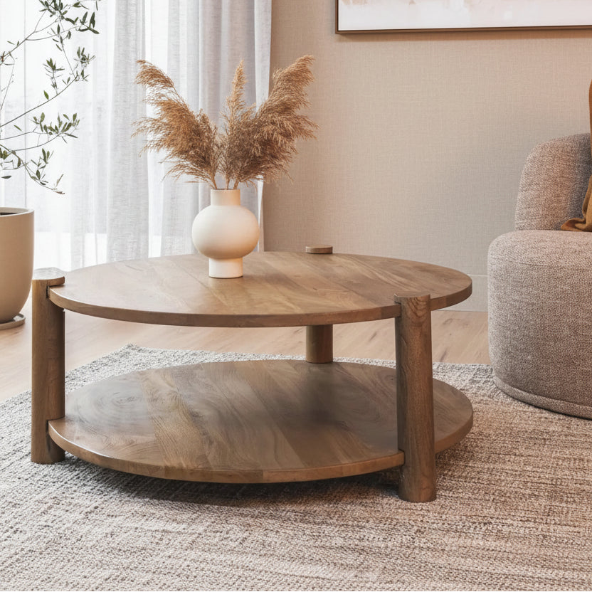 Wooden coffee table with a decorative vase in a living room setting.