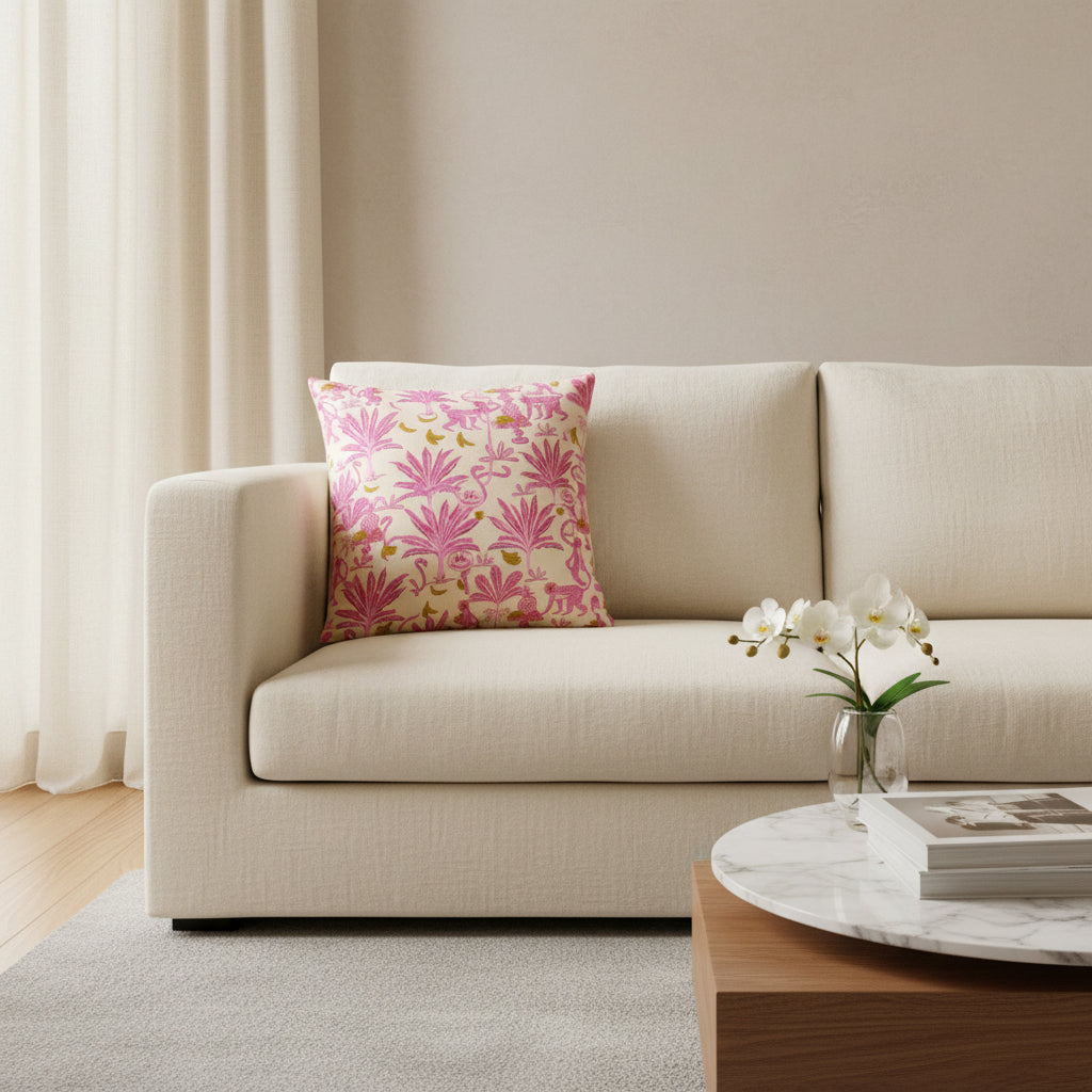 Decorative pillow with pink flamingo and monkey pattern on a white background