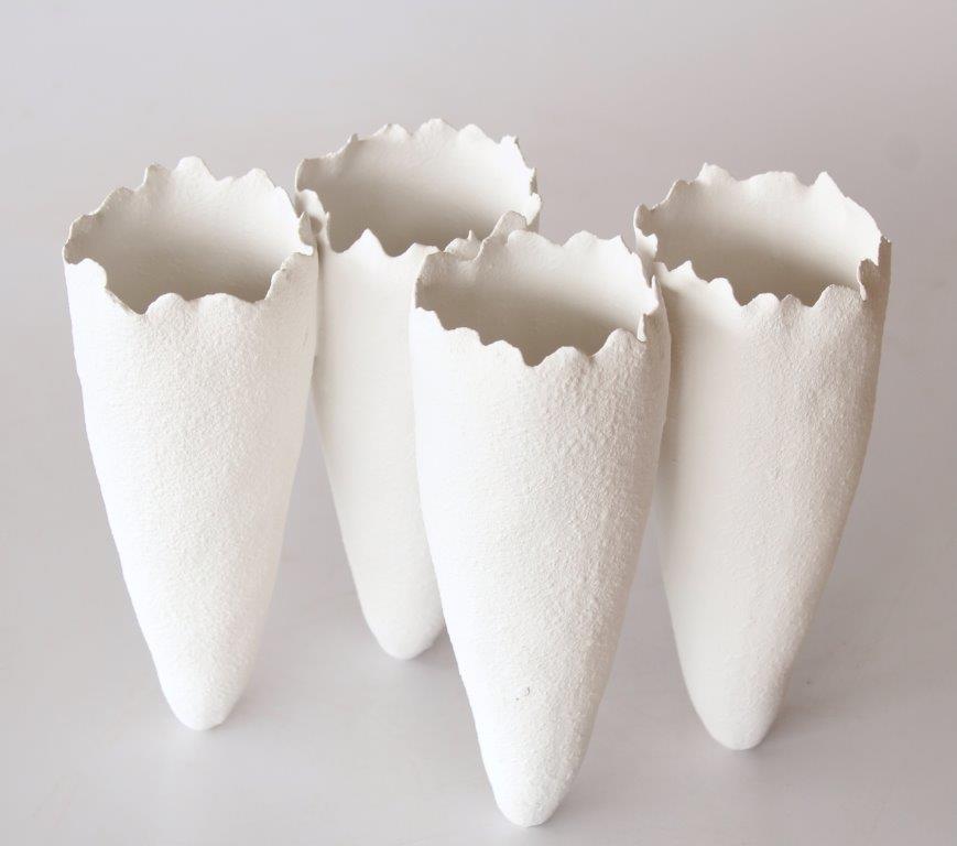 4 White Ceramic Vases Joined Upright