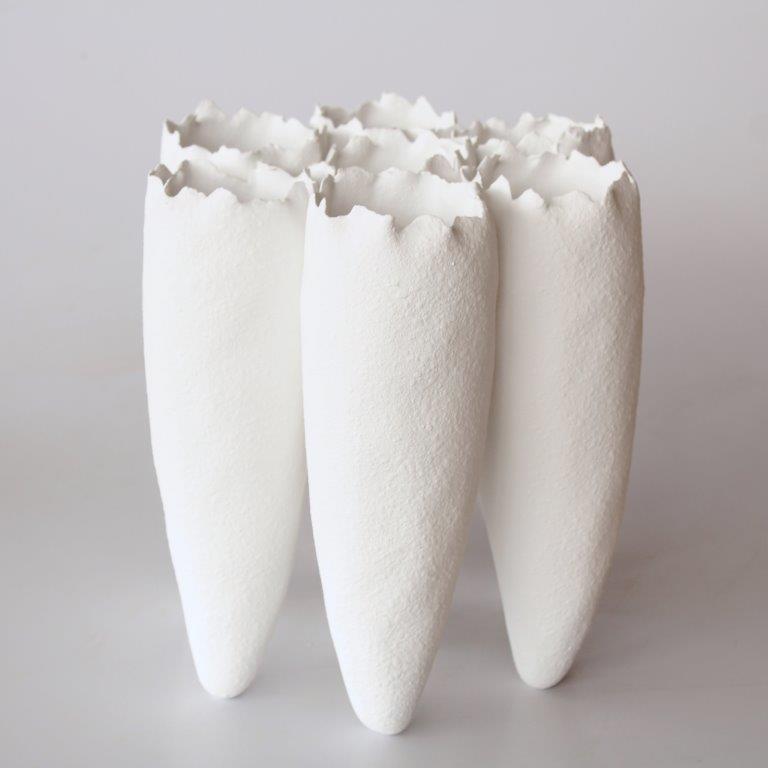 7 White Ceramic Vases Joined