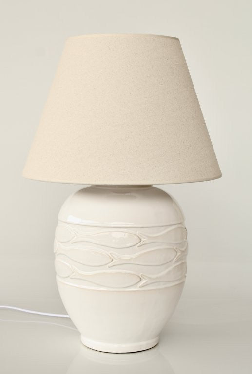 White textured table lamp with beige lampshade on a light background