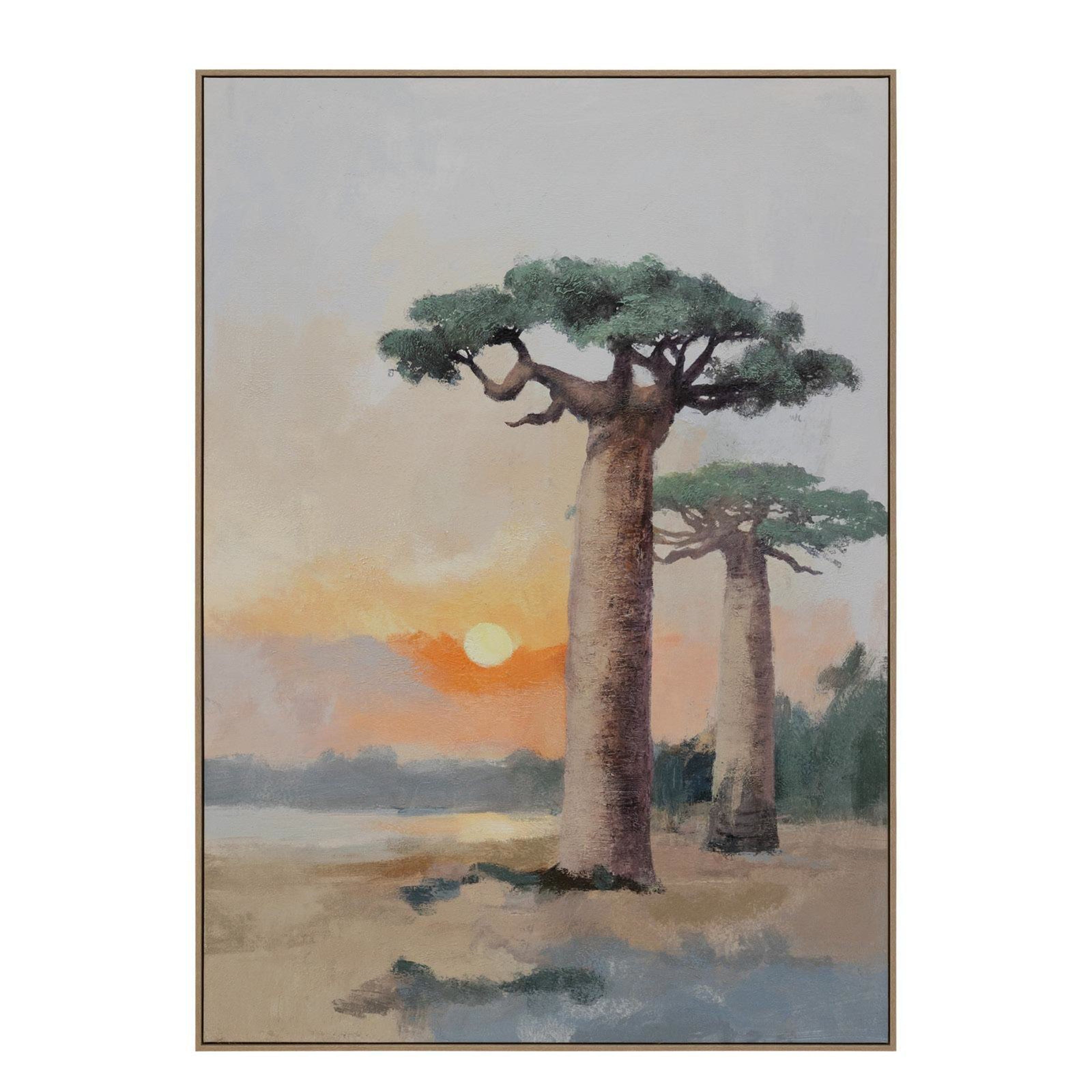 Framed artwork of two trees with a sunset background