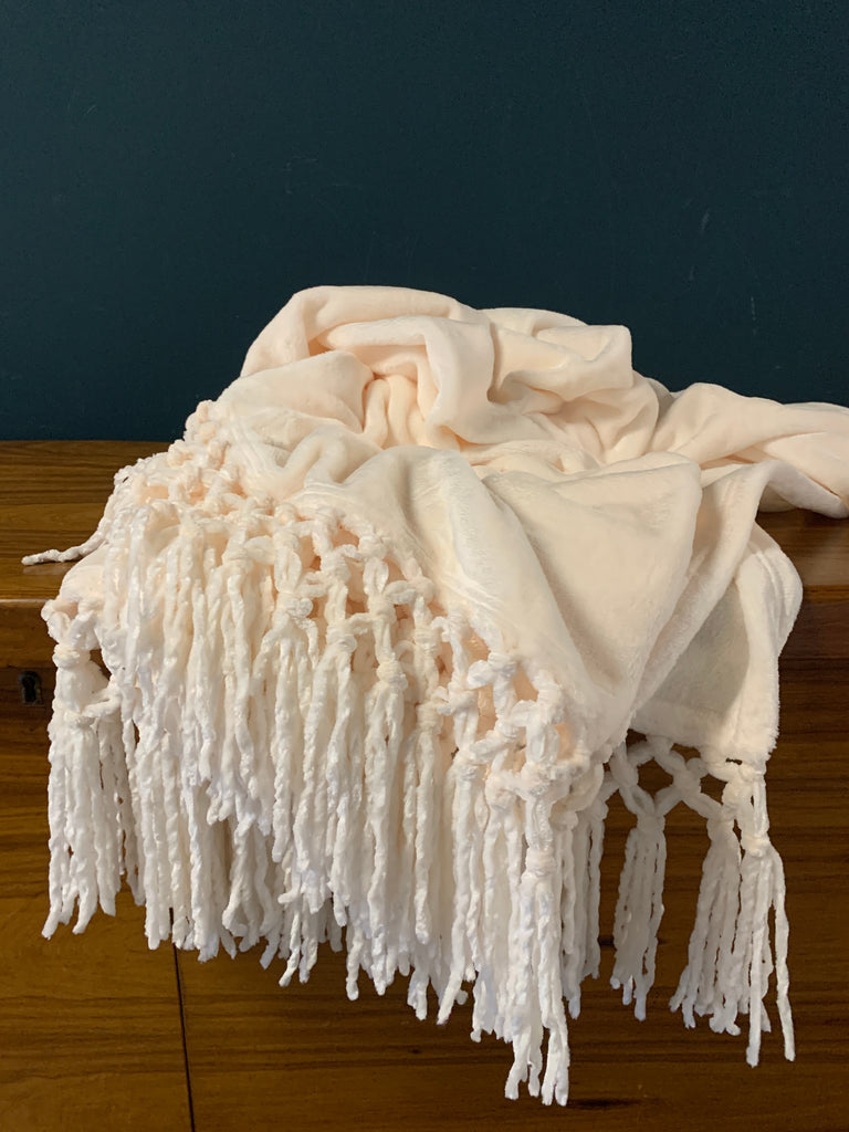 Indulge in luxury with our Plush Throw in Cream. Made with premium materials, this throw is not only soft and warm, but also adds an elegant touch to any room. Wrap yourself in comfort and style with this sophisticated piece. A must-have for those who appreciate the finer things in life.