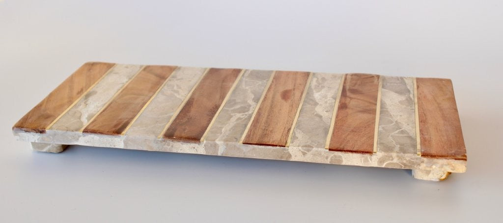 WOOD, BRASS AND BEIGE MARBLE STRIPED BOARD ON FEET