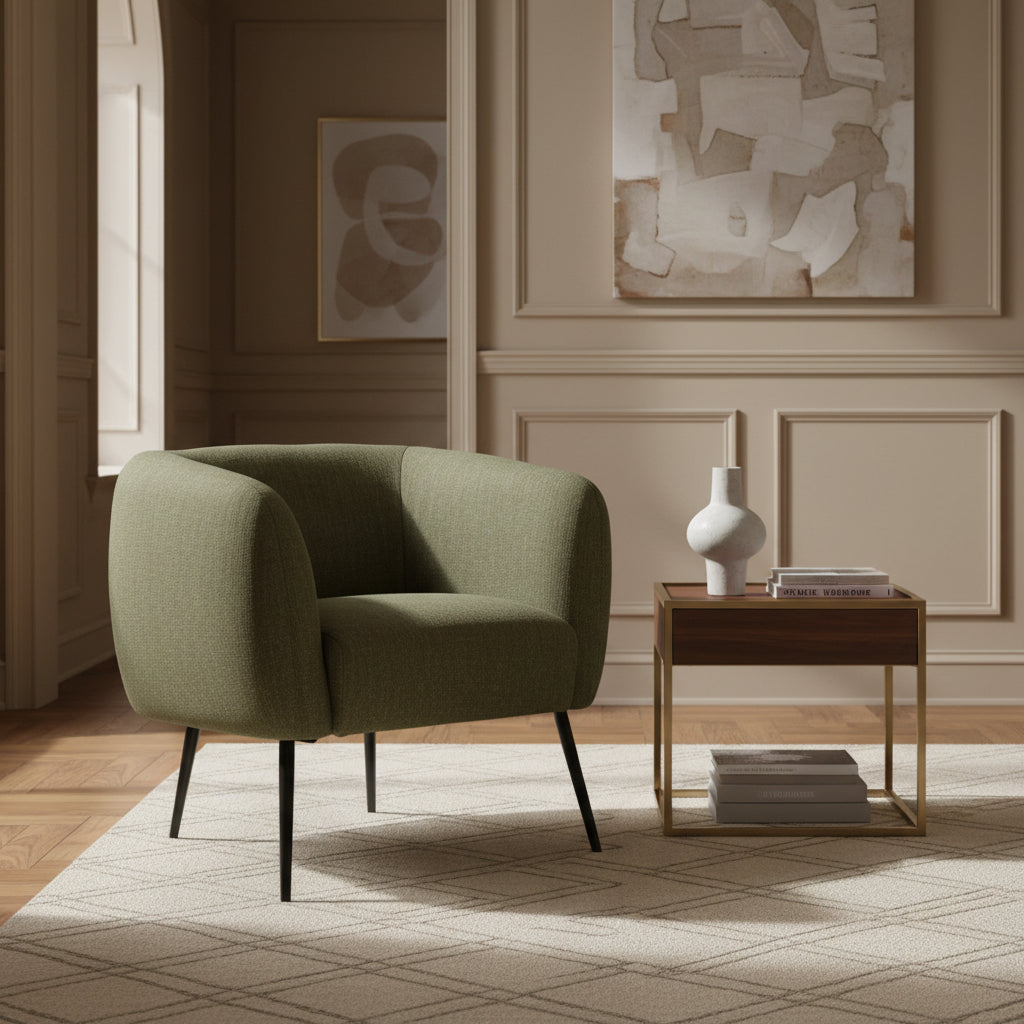 Green armchair with black legs on a white background