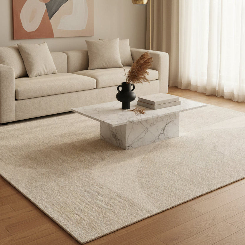 Beige rug with a subtle pattern on a white background