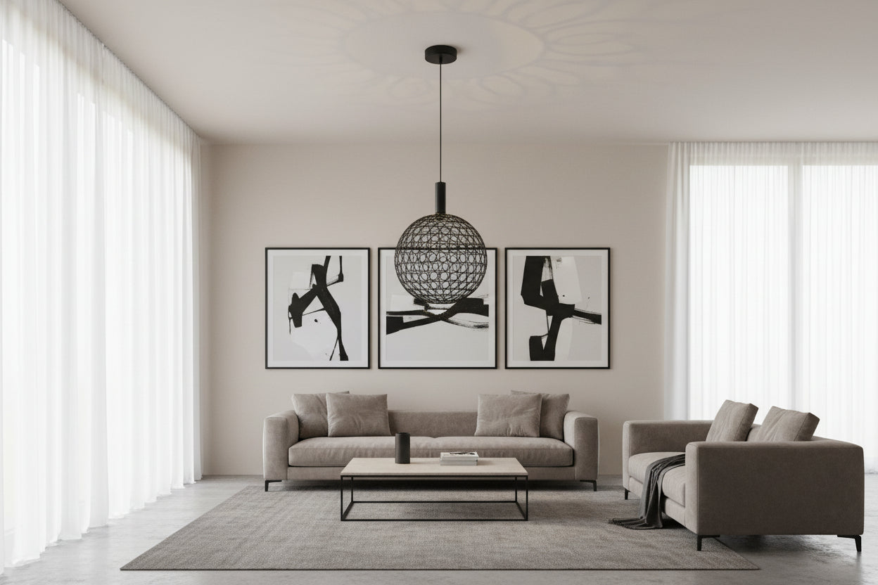 Black spherical pendant light with a textured design on a black background