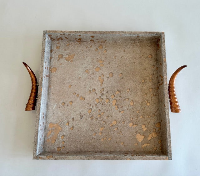 Rose gold cow skin tray with springbok handles