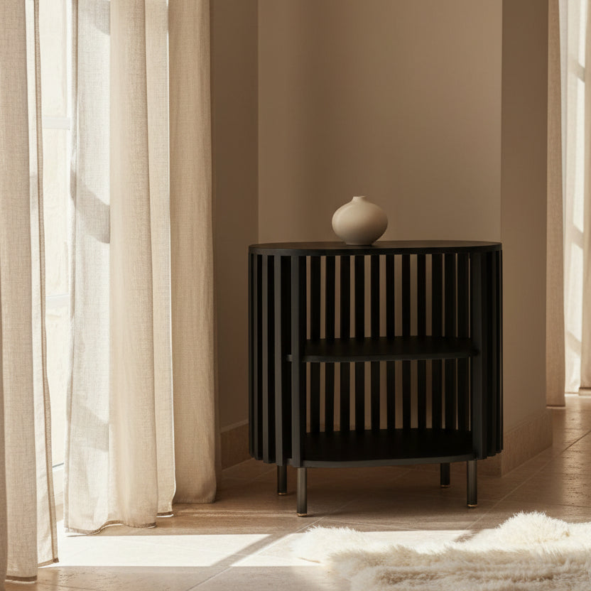 Black crib with slatted design on a white background