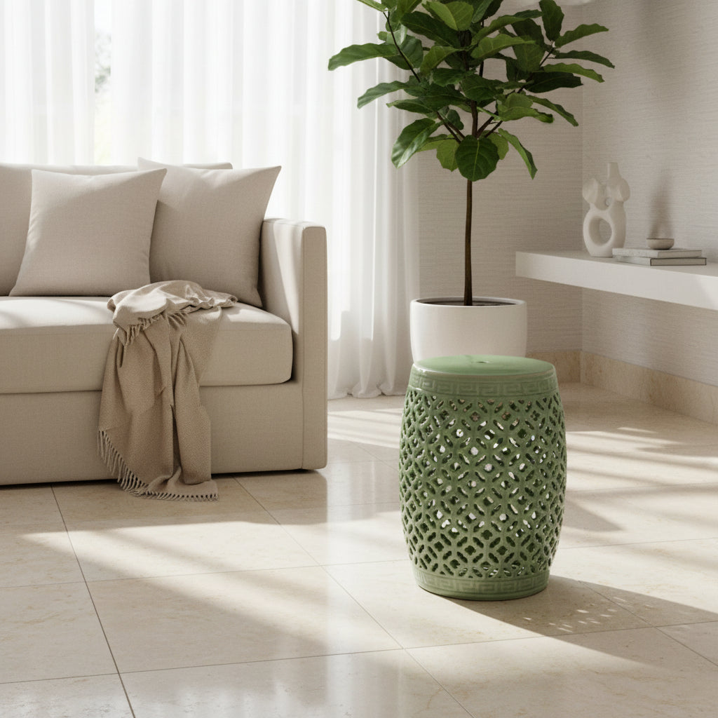 Green ceramic garden stool with lattice design on a beige background